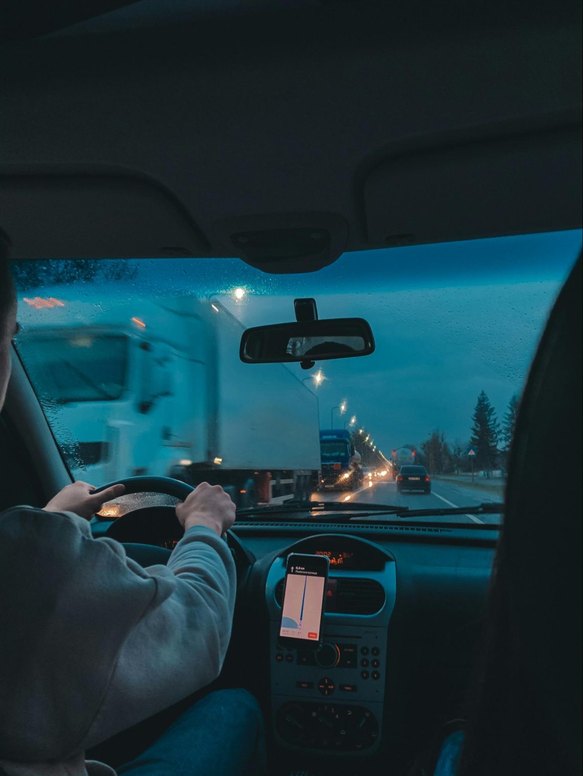 A person drives after certified auto glass installation in Denver