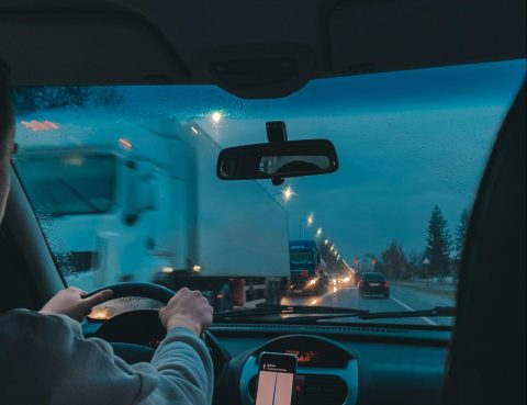 A person drives after certified auto glass installation in Denver