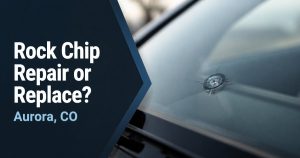 Close-up of a star-shaped rock chip in a car windshield, with the title Rock Chip Repair or Replace? Aurora, CO