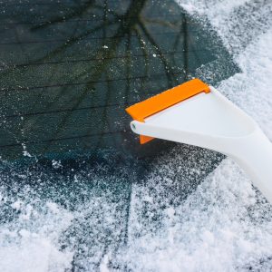 Scraper for cleaning ice from car windows